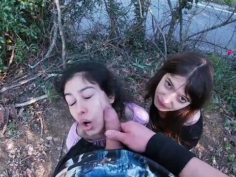 Three woman having fun and playing sexual games in a park after school.