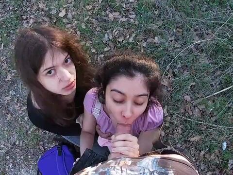 Three woman having fun and playing sexual games in a park after school.